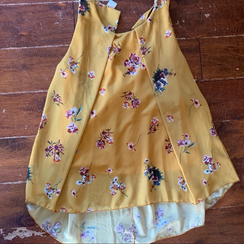 Twik: yellow sleeveless blouse